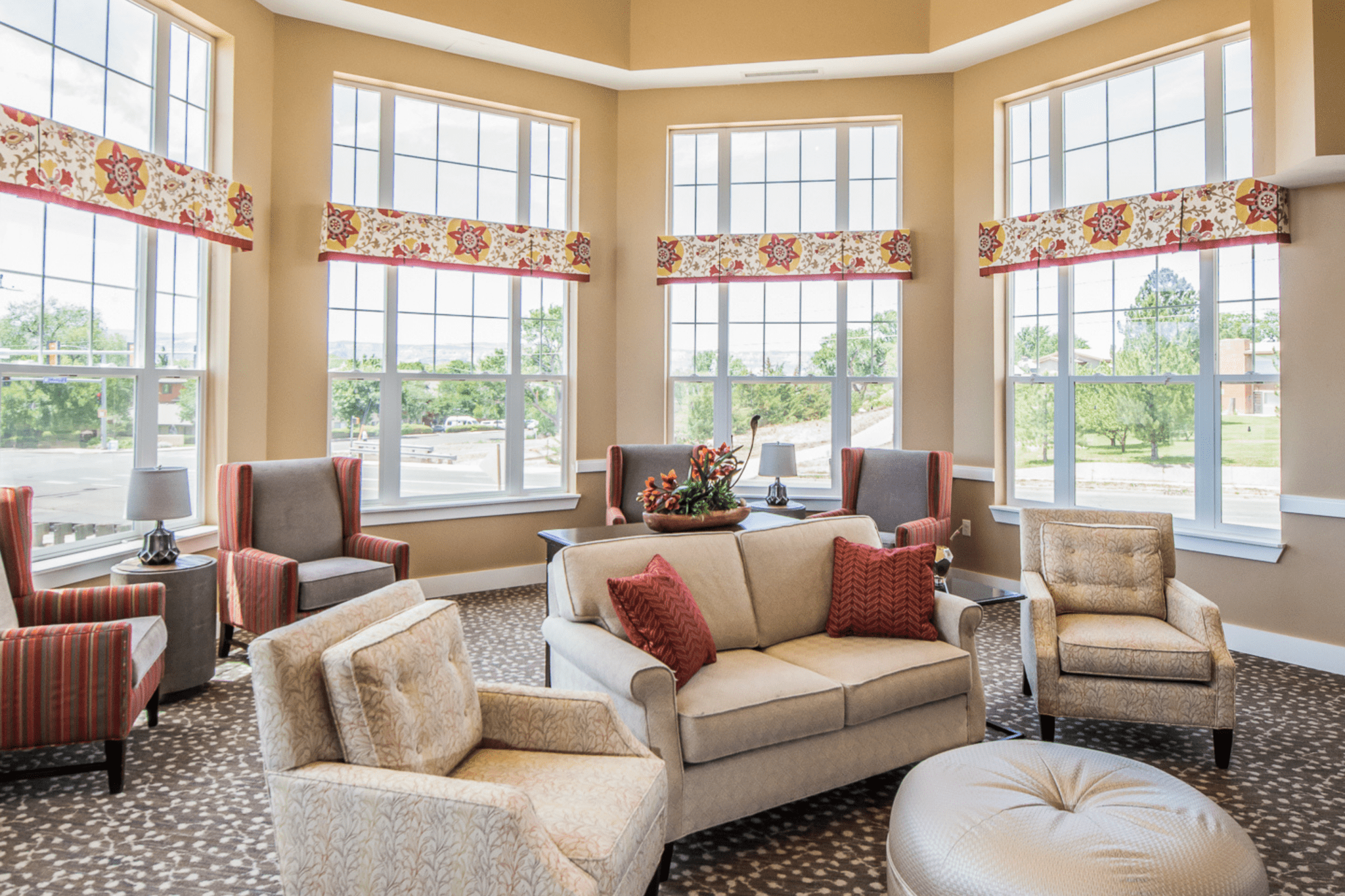 interior community seating area with tall windows large landscape